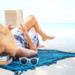 Image of woman at beach illustrating may I concept of refreshing during summertime.