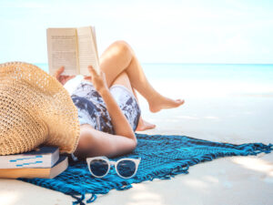 Image of woman at beach illustrating may I concept of refreshing during summertime.