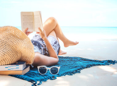 Image of woman at beach illustrating may I concept of refreshing during summertime.