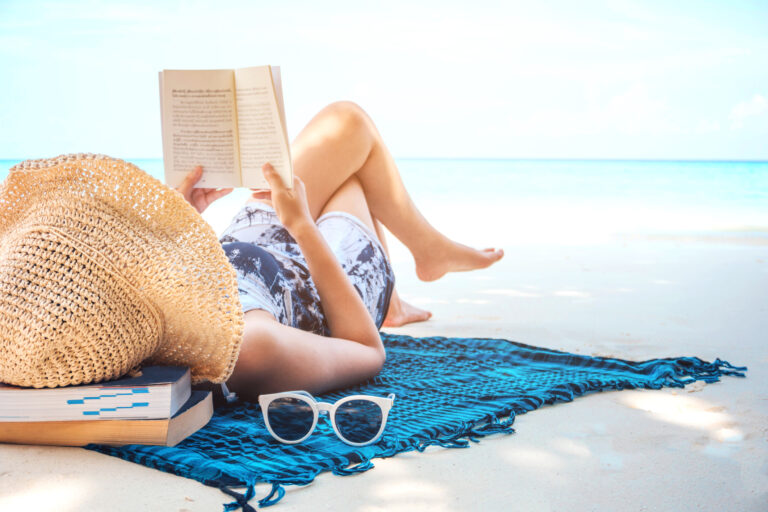 Image of woman at beach illustrating may I concept of refreshing during summertime.
