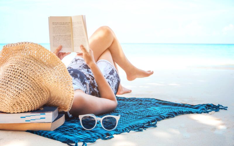 Image of woman at beach illustrating may I concept of refreshing during summertime.