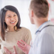 Doctor and patient discussing progressive lenses.