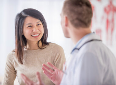 Doctor and patient discussing progressive lenses.