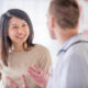 Doctor and patient discussing progressive lenses.