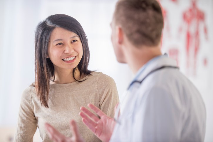 Doctor and patient discussing progressive lenses.