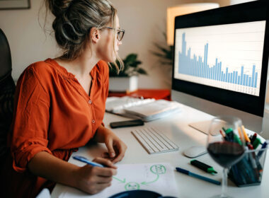 Woman, perhaps practice owner, looking at metrics to improve downtime in her office to make business pick up.