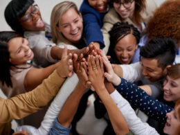 A big team going in for a group high five