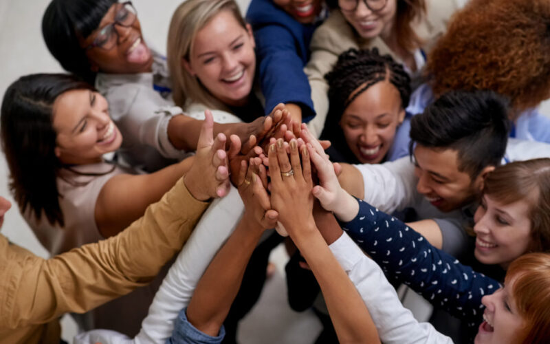 A big team going in for a group high five
