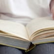 A woman flipping the page, symbolizing a new chapter