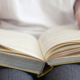 A woman flipping the page, symbolizing a new chapter